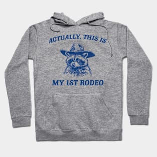 Raccoon Actually This Is My First Rodeo Funny Trash Panda Meme Hoodie